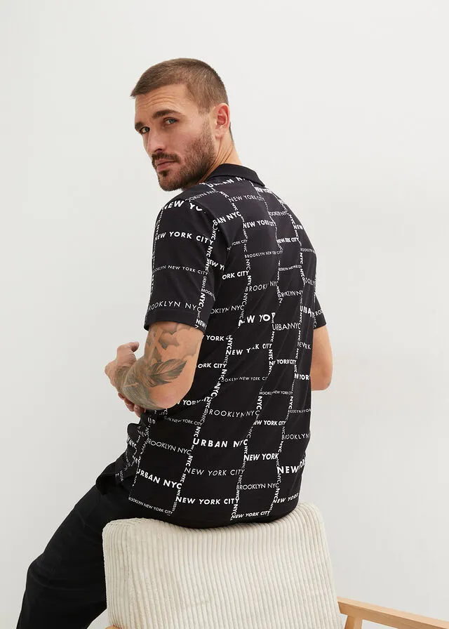 CAMISETA DE TIPO POLO NEGROBLANCO